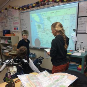 Students work together to find various features of Washington. 